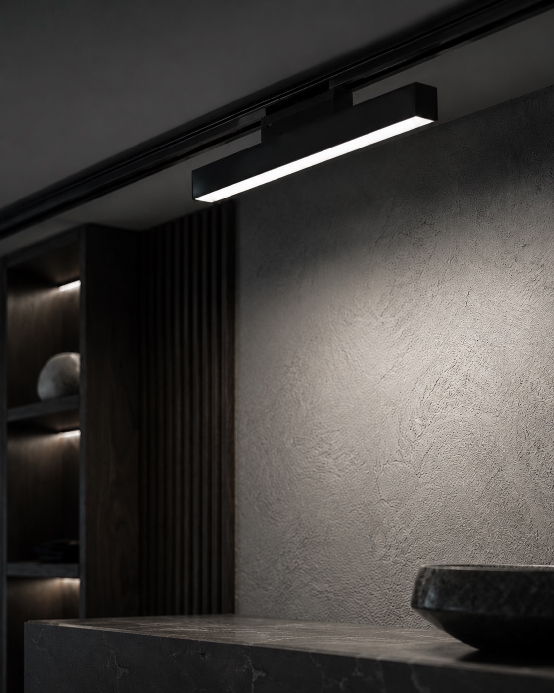 Linear track bar lighting a stone vanity counter